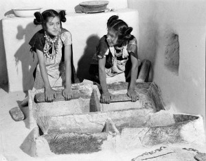 Girls Grinding Corn in Puberty Ceremony,  Shungopovi Village-2nd Mesa. Left, Belvera Nuvamsa, Right, Mary Anna Nuvakaku, June 28, 1949. HCPO.PH.2003.1.HH1.3