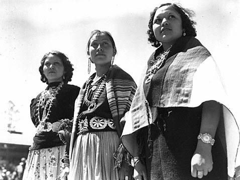 Image of Pow Wow. [Two Navajo women and one Hopi woman, Emmalee Mary Shupela, taking part in the Flagstaff All Indian Pow Wow.], 1946