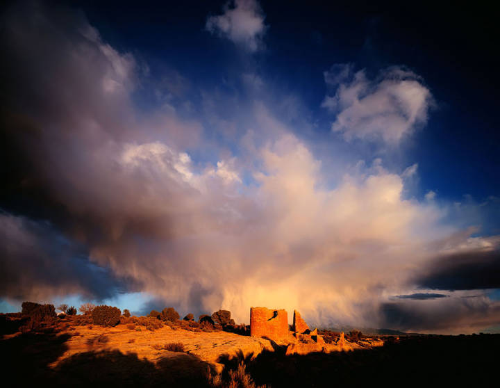 This image shows storm clouds above dwellings in Hovenweep National Monument